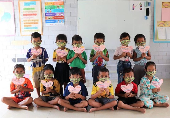 Cambodian children wearing mask covers from Taiwan